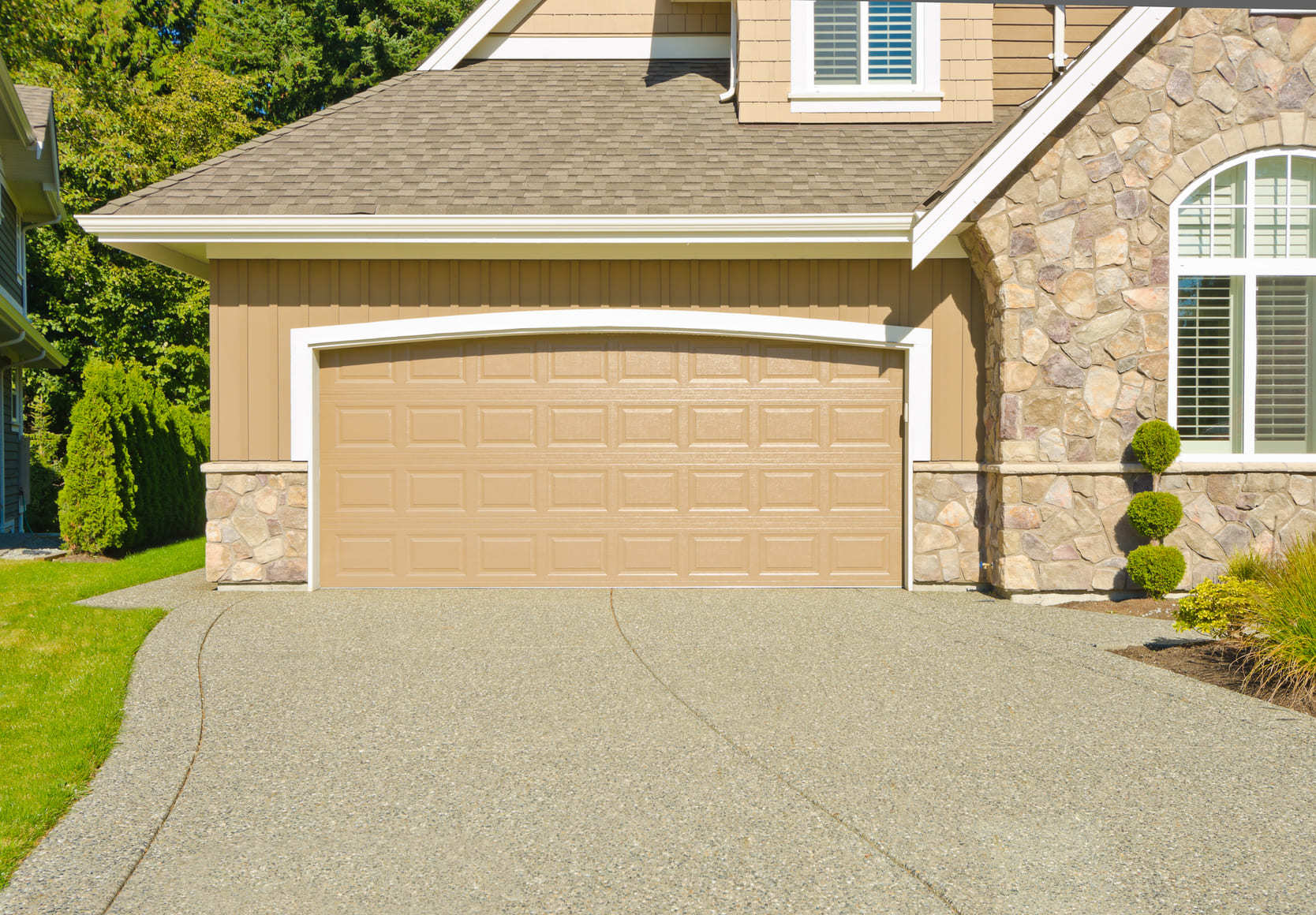 Home with a garage typical of homes for sale in Courtice, Ontario